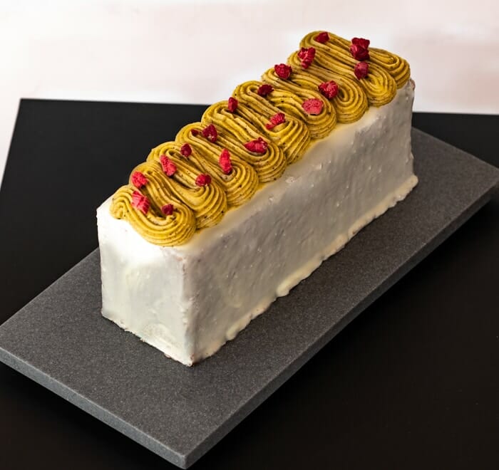 Travel Cake Pistachio, with White Chocolate and pistachio ganache- right angle view